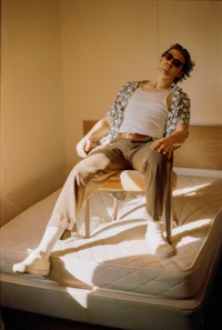 a man laying on top of a bed