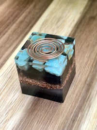 a glass box with a spiral design on it
