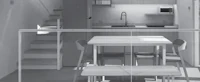 a black and white image of a kitchen with a table and chairs