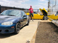 a blue mazda sports car