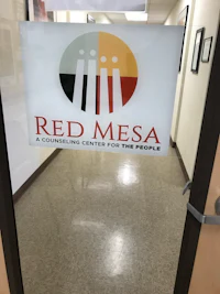 red mesa logo on a glass door