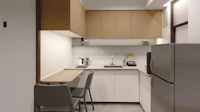 a room with a table and chairs and a staircase