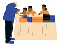 a group of people standing at a table