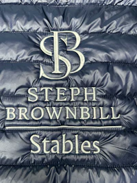 a close up of the logo for stephen brown stables