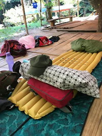 a sleeping bag on a wooden deck