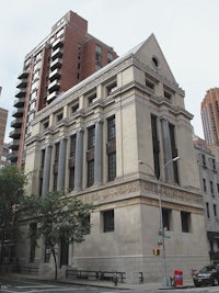 a large building on the corner of a street