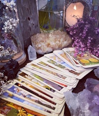 tarot cards and crystals on a table