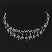 a silver chain bracelet with beads on it