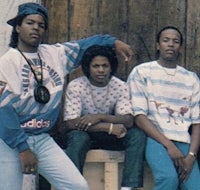 three young men posing for a picture