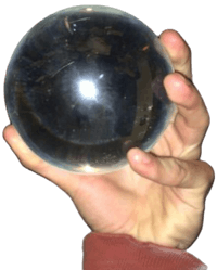 a person holding a crystal ball in their hand