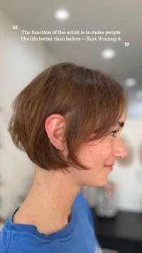 a woman with a short haircut in a salon