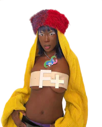 a black woman wearing a colorful sweater and hat