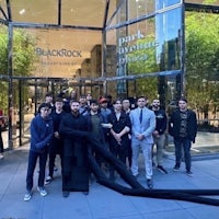 a group of people standing in front of a building