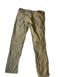 a pair of khaki pants on a black background