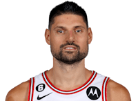 a basketball player wearing a white jersey with a beard