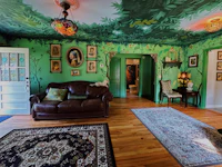 a living room decorated with a jungle theme