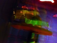 a blurry image of a dancer in a club