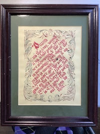 a framed piece of art with a poem on it