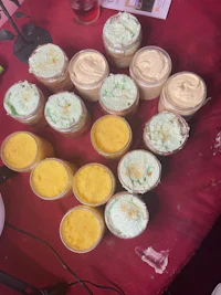 a table full of cupcakes on a red table