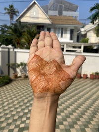 a person's hand with a pattern on it