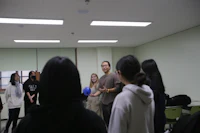 a group of people standing in a room