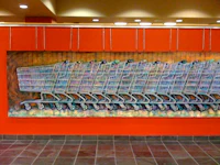 a painting of shopping carts on a wall