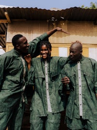 a group of people in green clothing