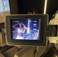a video camera is being used to take a picture of a woman