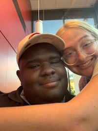 a man and a woman hugging in a restaurant