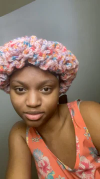 a woman wearing a crocheted headband