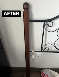 a bed with a metal headboard and footboard