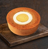 a cake with an egg on top of it