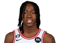 a basketball player with dreadlocks posing for a photo