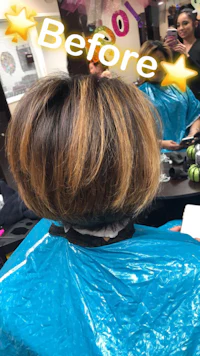 a woman is getting her hair done in a salon