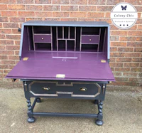 a purple and black desk with drawers