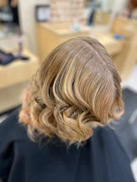 the back of a woman's hair in a salon