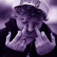 a man wearing a beanie and a purple hat