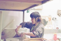 a woman working in a kitchen