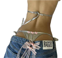 a woman in a bikini with a bow on her back