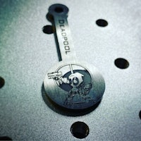 a metal spoon with a cartoon character on it