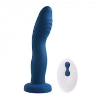 a blue and white sex toy next to a white disk