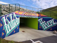 a colorful mural painted on the side of a tunnel