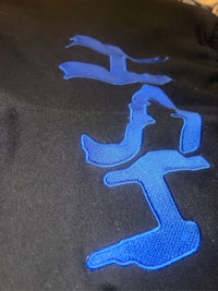 a black hoodie with blue embroidery on it