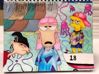 a calendar with a drawing of a cartoon character and an octopus