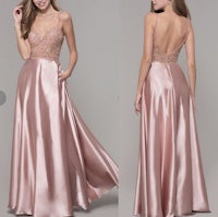 a pink satin prom dress with a v - neckline and beading