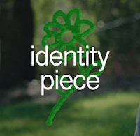 a child is holding a green flower with the words identity piece on it
