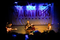 a group of people on stage at a concert