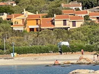 an aerial view of a house on the beach