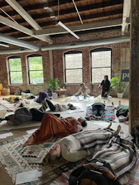 a group of people laying on the floor in a room