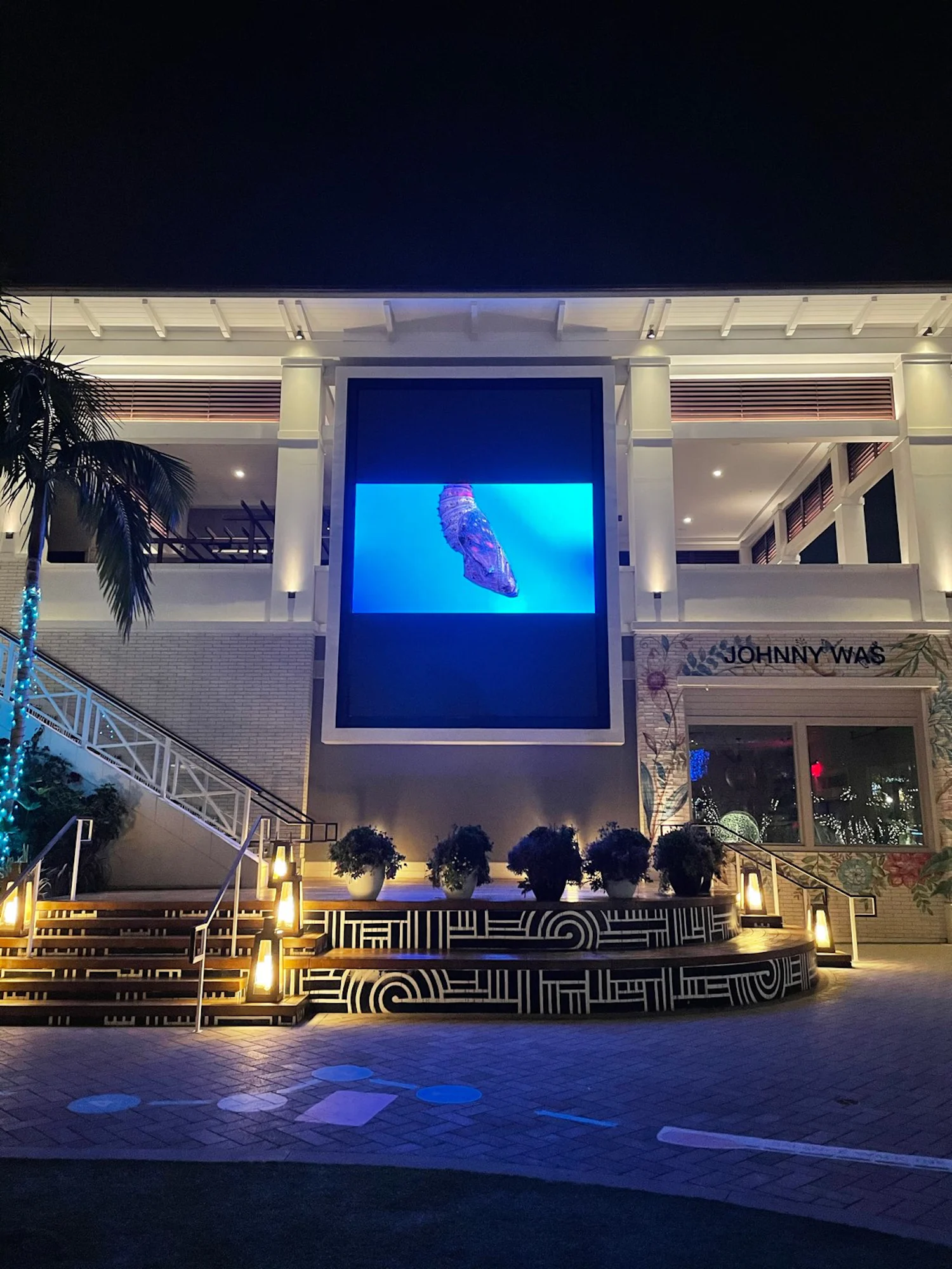a building with a large screen in front of it